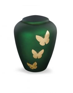 Urna funeraria de vidrio con mariposas verdes - símbolo de transformación y libertad